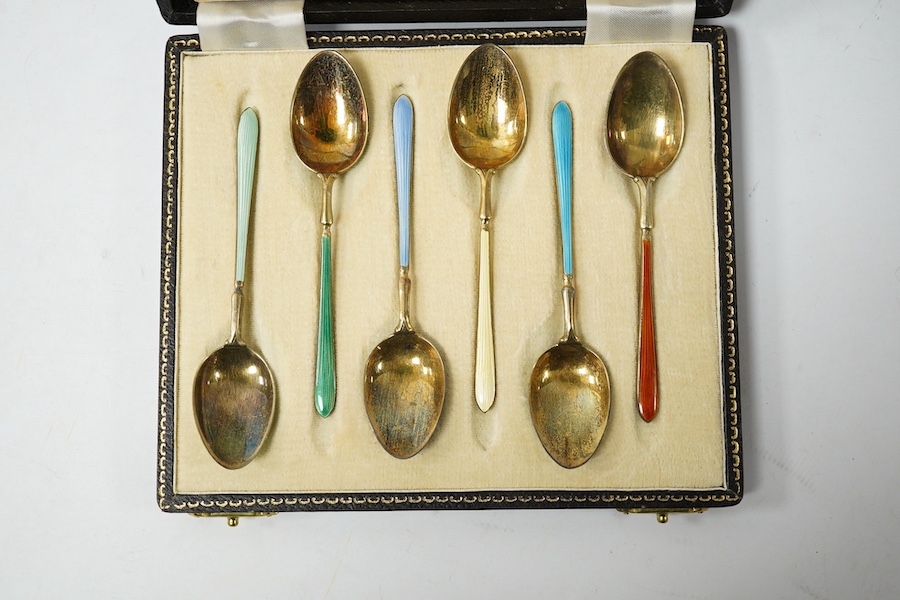 A cased set of six early 1950's silver gilt and polychrome enamel coffee spoons by Suckling Ltd (enamel a.f.). Condition - poor to fair